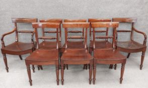 A set of eight early 19th century mahogany bar back dining chairs with rope-back spindles and