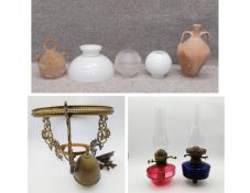 Two terracotta vessels to include a twin-handled amphora and a Spanish Botijo, H.42cm (largest)
