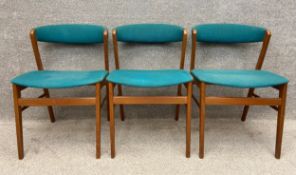 Three mid-century Danish style teak chairs upholstered in teal fabric. H.74cm.