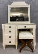 A contemporary white French style dressing table and mirror, along with a matched x-frame stool. H.