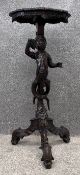 A 19th century walnut Venetian style occasional table on carved figural pedestal support. H.92cm