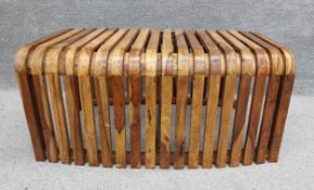 A mid-century Italian bent olivewood bench from a station waiting room in Bologna. H.48 W.98 D.60cm