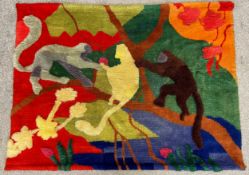 A mid to late 20th century tufted wool wall hanging depicting monkeys in a tree. H.133 W.178cm.