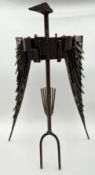 A mid-century abstract figural sculpture of a bird with spread wings made with sheet metal and steel