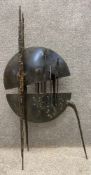 A mid-century welded and patinated steel sheet metal sculpture, in the form of an abstract insect or
