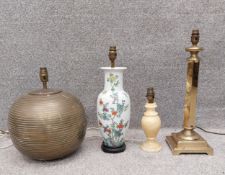 A collection of four table lamps to include, one ribbed ceramic of globular form, one Oriental style