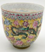A late 19th/early 20th century Chinese Famille Rose eggshell porcelain tea bowl with a hand