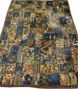 A large mid-century European rug with allover abstract geometric designs over a midnight blue field,