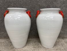 A pair of large ceramic vases/amphoras with painted handles. H.47cm.