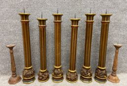 A set of six large 19th century continental oak and gilt candlesticks, each with a flared and