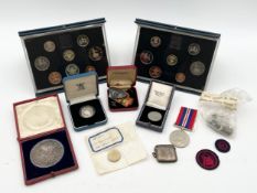 A collection of coins and other items to include a silver proof one pound, a silver hallmarked