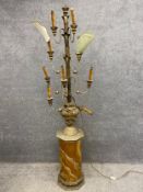 A 19th century floor lamp with a carved and gilt candlestick top, above two pairs over two sets of