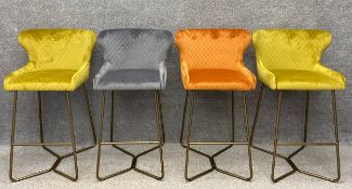A set of four vintage style brushed velvet wingback bar stools on tubular supports. H.99cm.