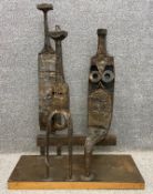A large abstract modernist figure group in welded steel on a plinth base by Robert De Quin. H.92 W.