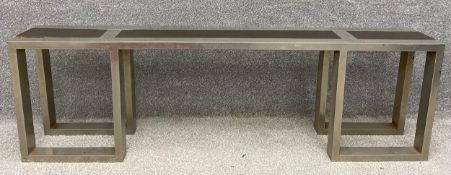A mid to late 20th century hall bench on a heavy steel frame with three metal clad panels. H.50 W.