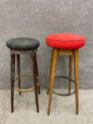 Two early to mid 20th century bar stools to include one with a circular black seat on four
