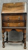 A William and Mary style mahogany writing bureau on stand of small size, the fall front opening on