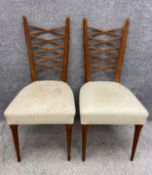 A pair of early to mid 20th century dining chairs with teak lattice work/trestle backs in off