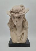 A signed and dated Austin Productions plaster bust titled 'Young Girl with Roses In Her Hat' 1979
