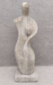 An abstract modernist style composite stone statue of a stylised mother and child on a square plinth