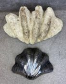 Two giant clam shell sculptures; one of naturalistic form in fibreglass, and the other Art Deco