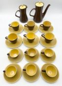 A Poole Pottery yellow and brown two-tone tea and coffee service comprising twelve cups and saucers,