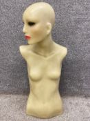 An early 20th century cast wax female mannequin with glass eyes and painted facial features. H.