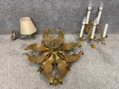 Three light fixtures to include a gilt metal and glass ceiling light with a scrolling floral and