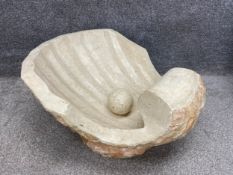 A large applied stone Art Deco style half clam shell after Magnussen Ponte with a pearl resting in