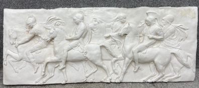 A plaster relief wall hanging plaque depicting four horsemen from a section of the Parthenon Frieze;