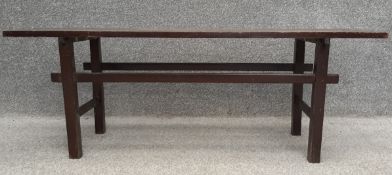 A mid-century Scandinavian style teak bench with four slats on square stretchered supports. H.40 W.
