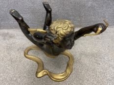 A mid-century Italian cast, patinated and gilt bronze coffee table base depicting Cupid in flight