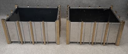 A pair of mid-century Italian polished steel and brass planters on casters in the manner of Willy