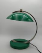 A mid-century Bauhaus style green enamel desk/table lamp with a curved brushed steel adjustable stem