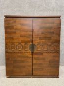 A parquetry veneered drinks cabinet. H.97 W.85 D.40cm (Some damage as seen).