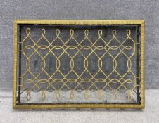 A vintage gilt bronze radiator cover. H.72.5 W.108 D.14cm
