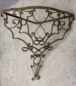 A vintage two section wrought iron corner console table. (Missing it's top and the two sections need