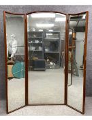 A vintage teak framed full height triptych dressing mirror with bevelled plates. H.170cm.