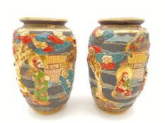 A pair of late 19th/early 20th century Japanese Kyoto polychrome Satsuma vases with hand painted