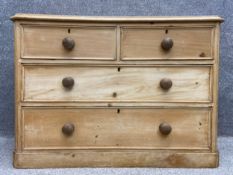 A late 19th century stripped pine chest of two short over two long drawers on a pedestal base. H.122
