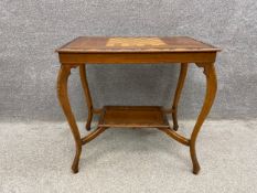 A late 19th century walnut chess table with an inlaid satinwood board and a moulded and carved