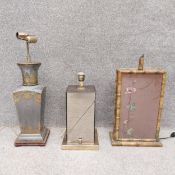 Three late 19th/early 20th century table lamps to include an engraved brass and sheet metal lamp