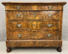 A late 18th/early 19th century French Louis Philippe commode with a solid walnut top above one