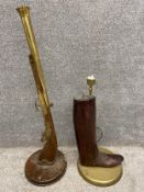 An early 20th century brass and carved boot-tree lamp, along with an early 20th century brass and