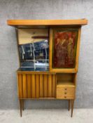 A 1960's vintage two section cocktail cabinet. In need of repair as seen. H.200 W.122 D.57.5cm