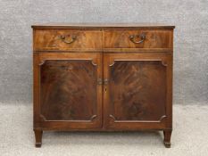 A 19th century flame mahogany and satinwood strung side cabinet, the top having an inlaid and