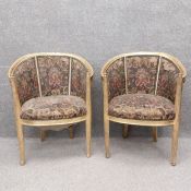 A pair of Louis XVI style gilt salon chairs with needlework/tapestry upholstery on tapering fluted