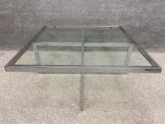 A mid-century chrome coffee table with an inset glass top in the style of Maison Jean Charles. H.