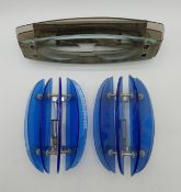 Two mid-century blue glass and tubular metal wall sconces/lights, along with another layered