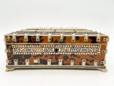 A 19th century Anglo-Indian Vizagapatam box with allover ivory fretwork and penwork panels depicting